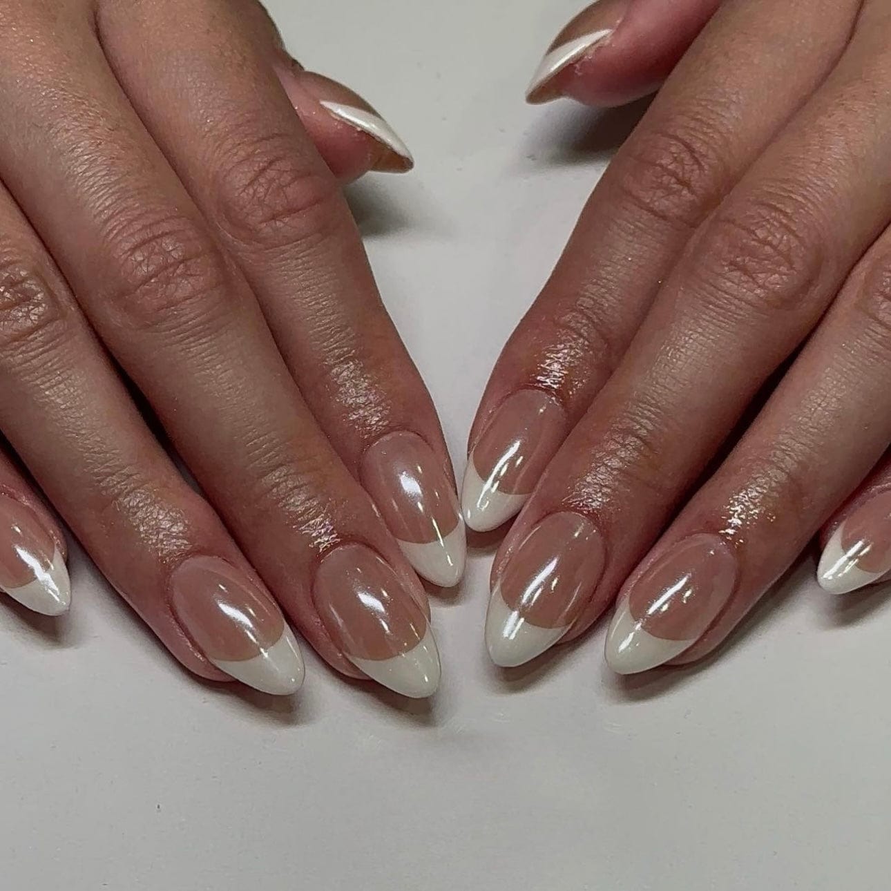 Short round nails adorned with glazed donut nails, offering a trendy and playful manicure option. 